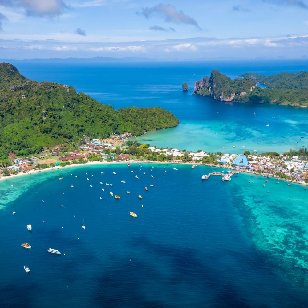 Phuket Tours Online Expat Run Phuket Tour Agency Hi Season Boat And Tourists On Phiphi Island Krabi Thailand Aeri